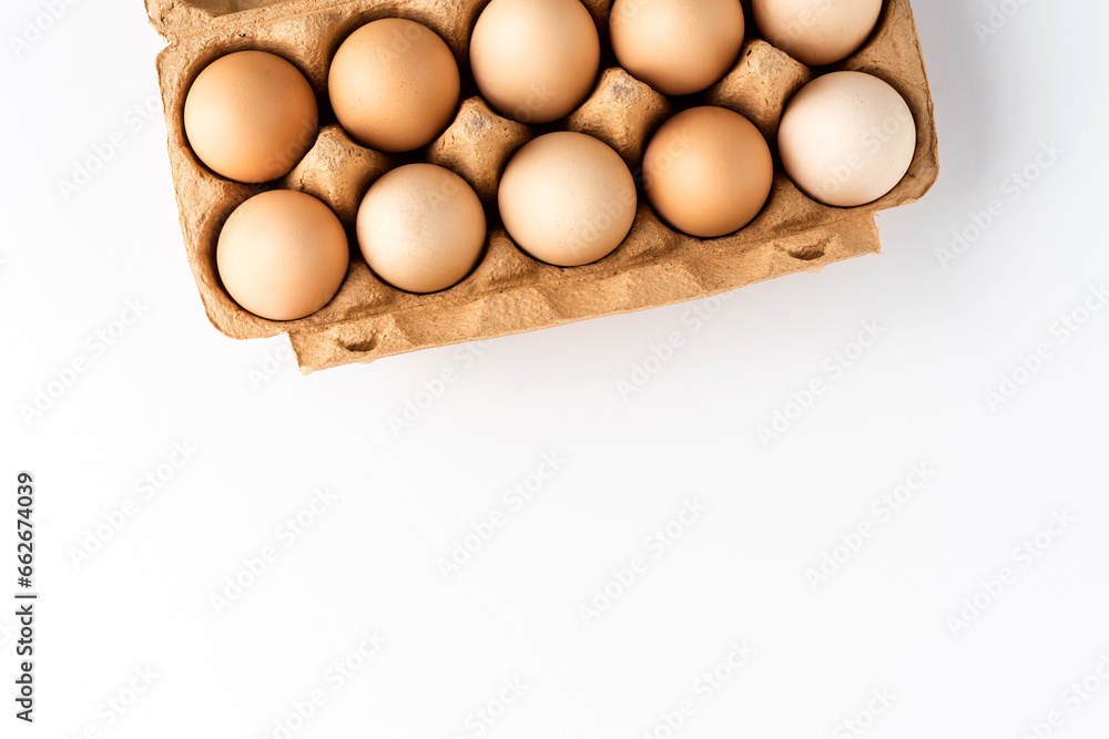 Fresh chicken eggs on white background with copyspace Fresh chicken eggs on white background with copyspace
