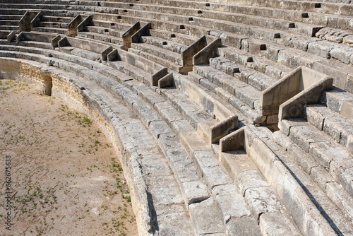 Close-up shot of the steps of the Roman amphitheater in Lecce-Italy, the access doors visible.