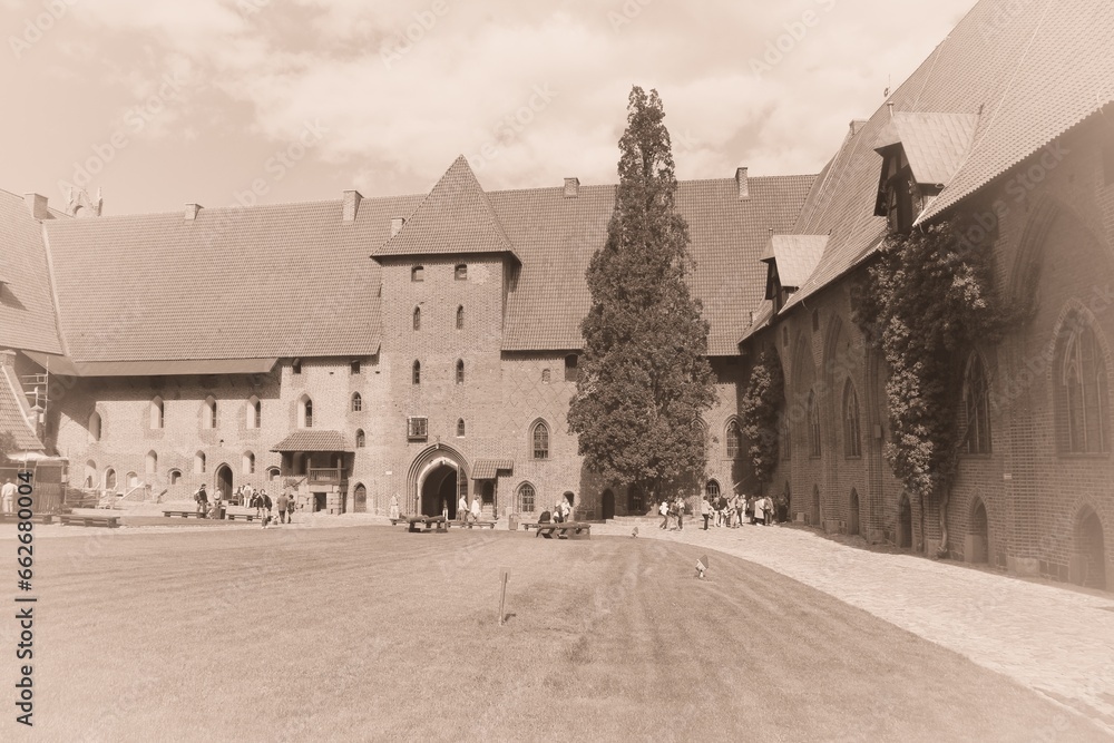 Malbork castle, Poland. Old postcard style - vintage paper sepia tone retro style.