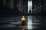 lonely candle flickering in a gloomy church
