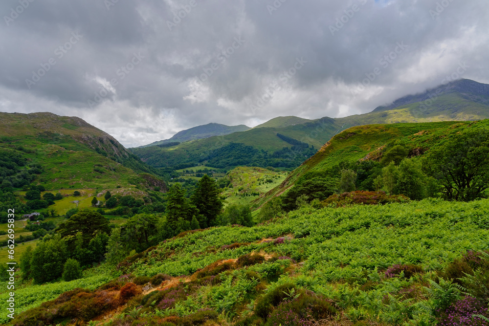 Rain clouds fill the sky over the hills and valleys in Eryri National Park near Beddgelert. Rain clouds fill the sky over the hills and valleys in Eryri National Park near Beddgelert.