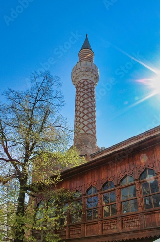 Dzhumaya Mosque against a bright blue sky in the background photo