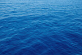 Rippled empty sea background texture, close up view. Wavy blue ocean water, ad template, copy space