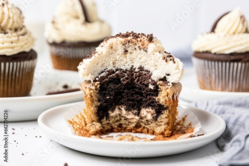 a cookies and cream cupcake with cookie crumb topping