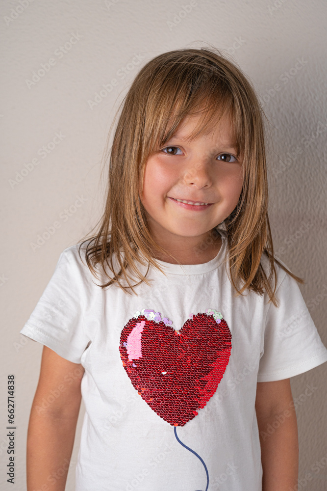 Happy 5 years caucasian girl in white t-shirt with red heart Happy 5 years caucasian girl in white t-shirt with red heart