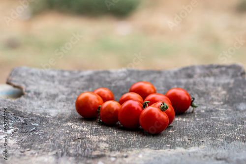 Fresh red tomatoes on a wooden board