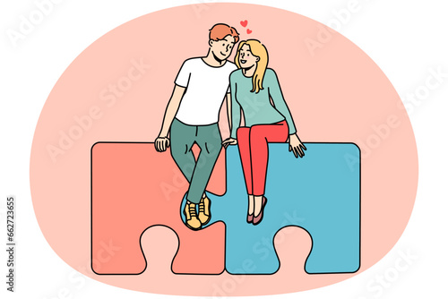 Happy couple sitting on jigsaw puzzles hugging. Smiling man and woman embrace find love together. Relationship and affection. Vector illustration.