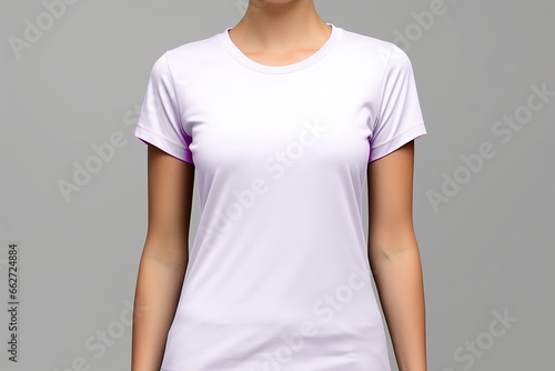 close up of a white tshirt worn by a model on plain background