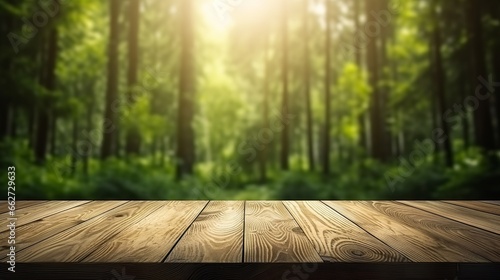 Empty light wood table top perspective and blurred forest background.