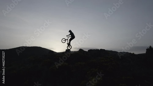 Drone Footage of Trial Biking on Rocky Terrain at Sunset 1 photo