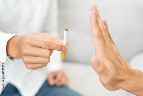 No smoking. Man stop smoke, refuse, reject, break take cigarette, say no. quit smoking for health. world tobacco day. drugs, Lung Cancer, emphysema , Pulmonary disease, narcotic, nicotine effect photo
