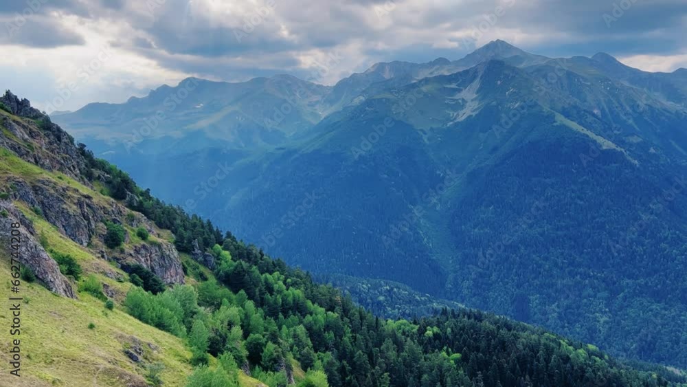 View of the mountain range near Mount Zakan. The top of the mountain node of the western part of the main ridge of the Greater Caucasus. Zakan Peak is the beginning of the Magisho mountain range. 4К View of the mountain range near Mount Zakan. The top of the mountain node of the western part of the main ridge of the Greater Caucasus. Zakan Peak is the beginning of the Magisho mountain range. 4К