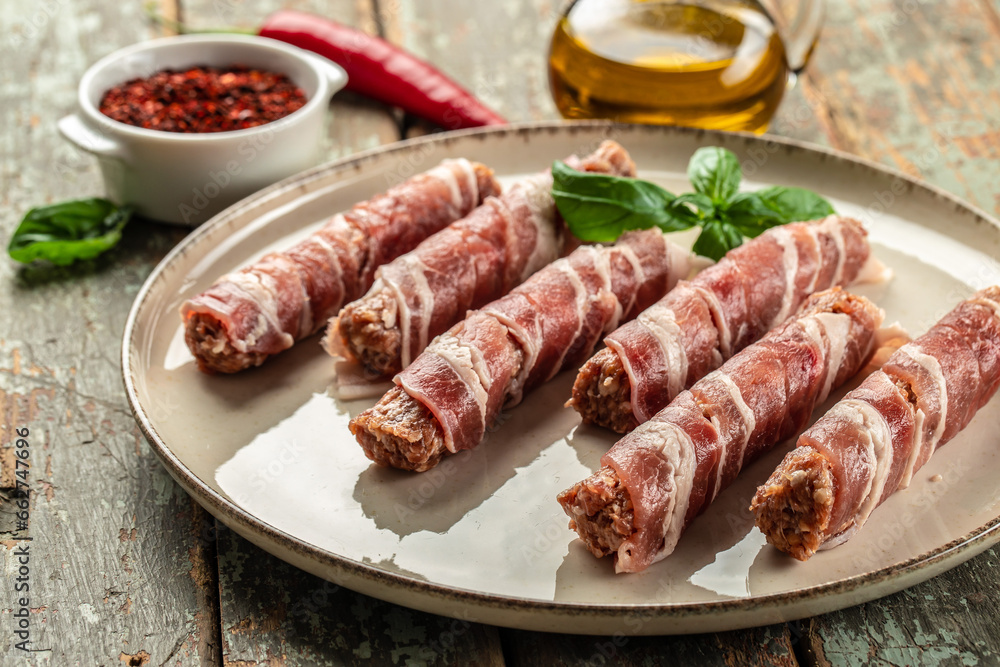 pork mince with bacon wrapped sausages. Food recipe background. Close up