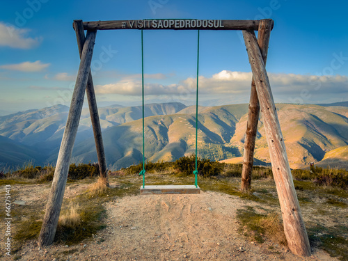 Wooden swing at Sao Pedro do Sul, with a beautiful view of Serra da Arada, in the center of Portugal.
