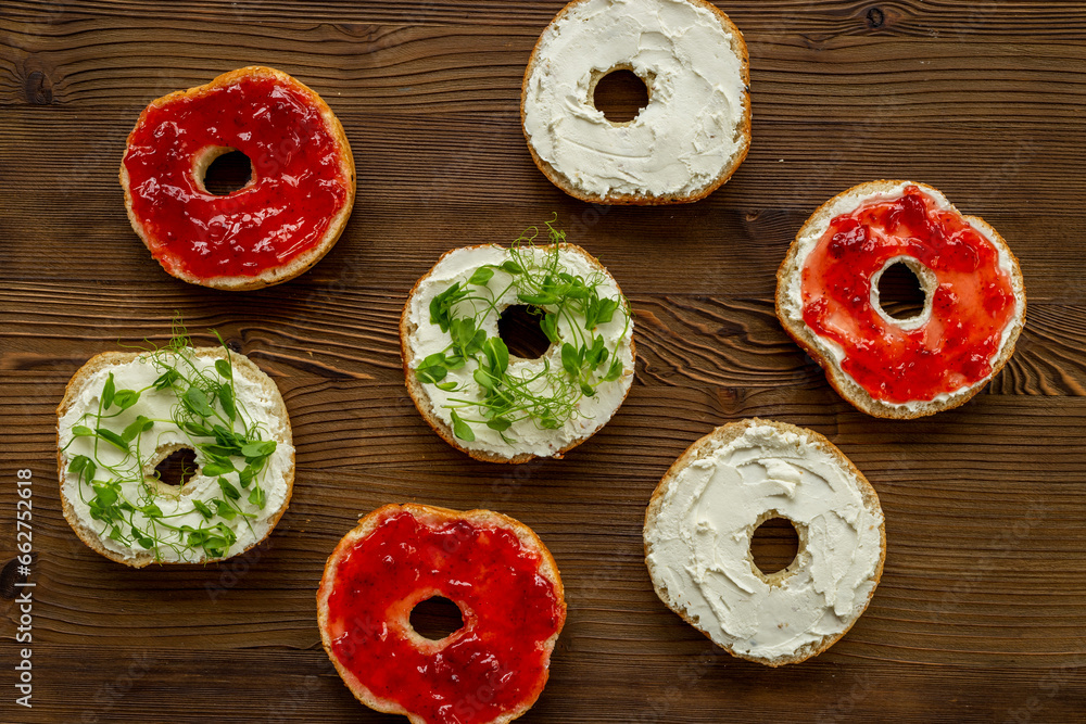 Set of fresh bread bagels with with berry jam and cheese cream. Healthy breakfast Set of fresh bread bagels with with berry jam and cheese cream. Healthy breakfast