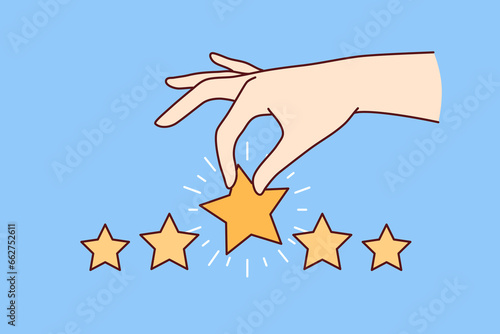Hand with stars is metaphor for feedback from customer positively evaluating service and giving rating 5. High user satisfaction rating after ordering online in restaurant or taking taxi ride