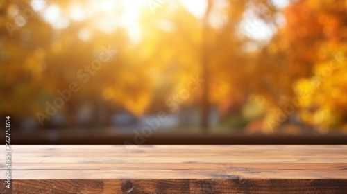Wooden table with a blurry golden tumn bokeh background