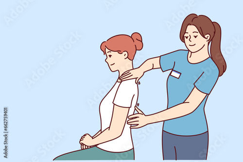 Woman physiotherapist gives massage to patient to relieve shoulder or back pain after failed workout. Girl works as physiotherapist and is engaged in chiropractic and helping people with sick spine