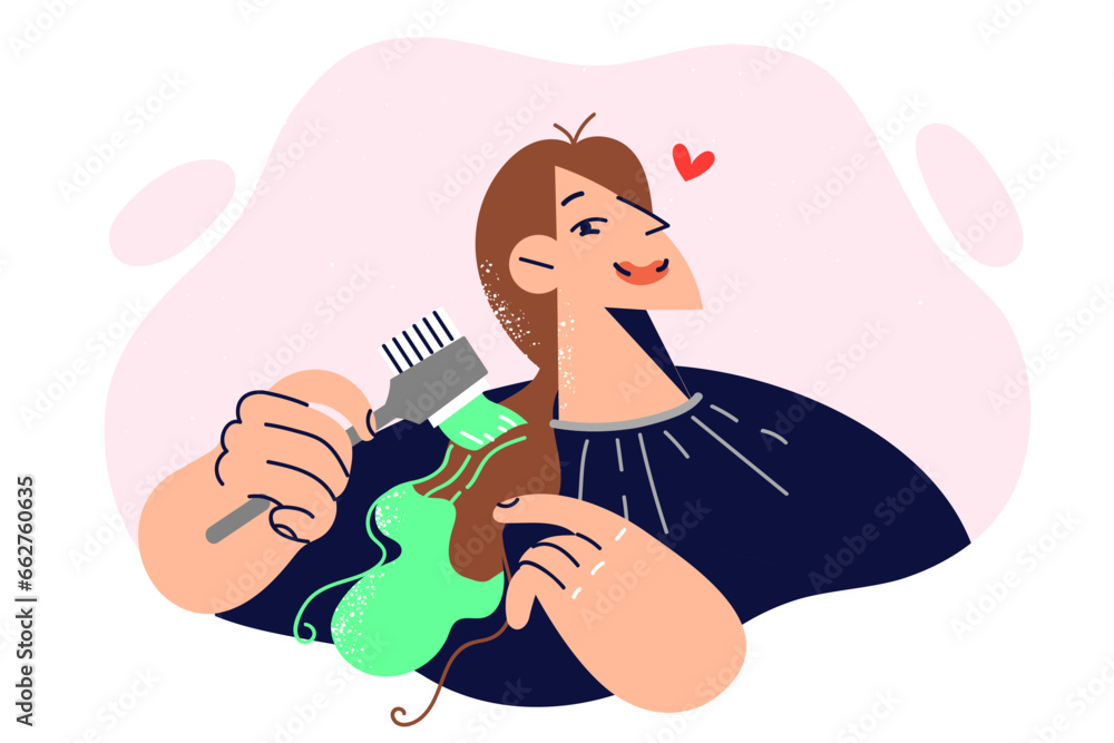 Woman dyes hair herself and holds brush with green paint, wanting to change style and update look Woman dyes hair herself and holds brush with green paint, wanting to change style and update look