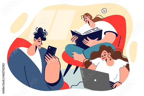 Family reads paper and electronic books, sitting in same room and using laptop or phone