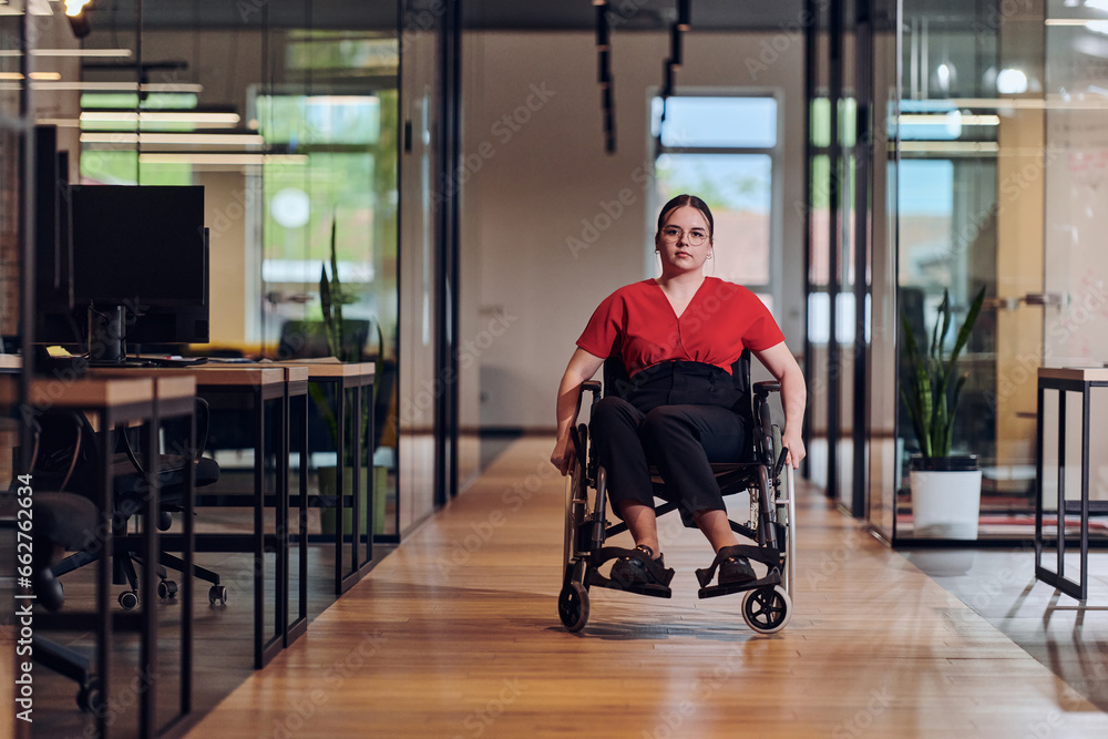 A modern young businesswoman in a wheelchair is surrounded by an inclusive workspace with glass-walled offices, embodying determination and innovation in the business world A modern young businesswoman in a wheelchair is surrounded by an inclusive workspace with glass-walled offices, embodying determination and innovation in the business world