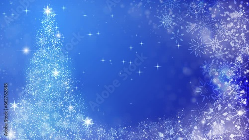 クリスマスツリーとキラキラ光るパーティクル、青背景