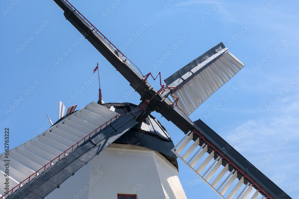 a beautiful anchient white windmill in aarsdale, Bornholm on a sunny day with blue sky