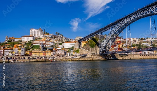 Stunning view of a bridge stretching over a river in the city of Porto  Portugal