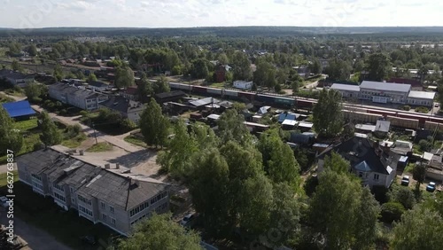 Wallpaper Mural Railway road going through village with moving train Torontodigital.ca