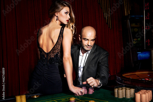 Beautiful couple playing casino games