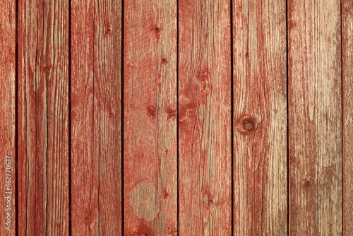 Closeup of vertical red painted wooden plank wall background texture.