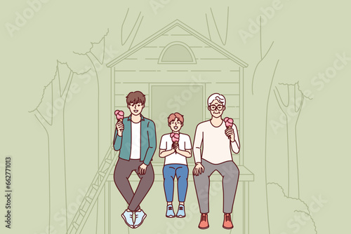 Generational succession of son, father and grandfather eating ice cream together sitting in tree house. Three generations of men are relaxing together in park and talking, enjoying taste cold dessert