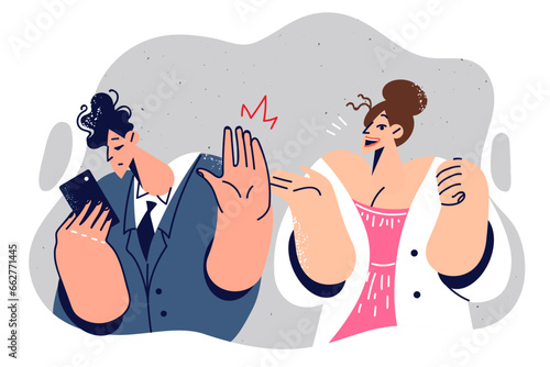 Man ignores woman who shows signs of attention and looks at phone, not wanting to get acquainted