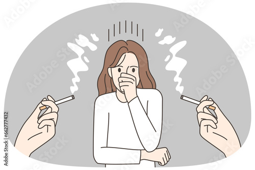 Unhappy woman suffer from passive smoking