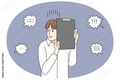 Stressed male employee frustrated with colleagues comments