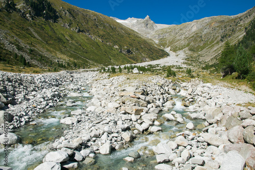 Typical alpine landscape with little stream in Valle Aurina, Italy