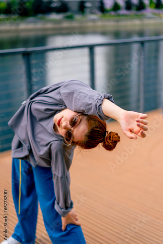 young street hip hop dancer in sportswear doing warm up before dance rehearsal hobby active lifestyle