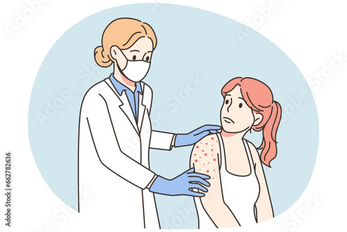 Doctor examine patient with red rash