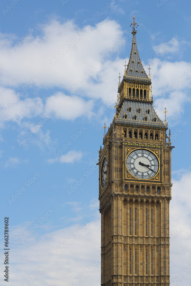 Closeup of iconic building in London, Big Ben on a sunny day with some clouds