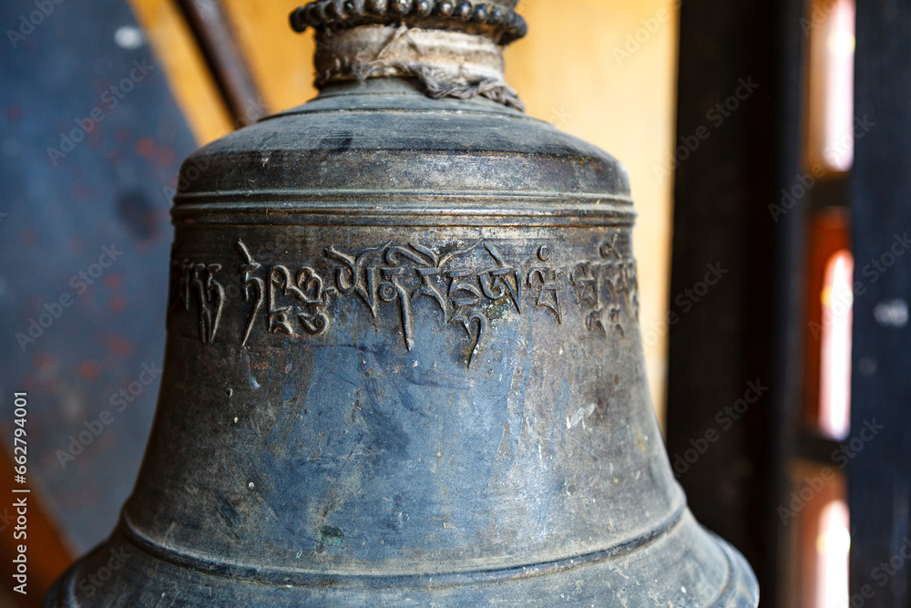 Bronze bell with Bhutanese writing inside of a Monks school monastery, Mongar, Bhutan, Asia Bronze bell with Bhutanese writing inside of a Monks school monastery, Mongar, Bhutan, Asia