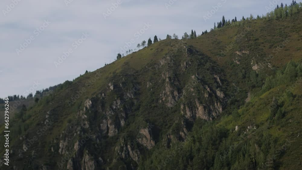 Timelapse of a cloud shadow covering the sunlighted green mountainside and fading it. Concept of outdoor active hiking tourism among the spectacular nature Timelapse of a cloud shadow covering the sunlighted green mountainside and fading it. Concept of outdoor active hiking tourism among the spectacular nature