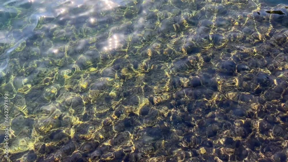 The glare of the sun on clear sea water. The glare of the sun on clear sea water.