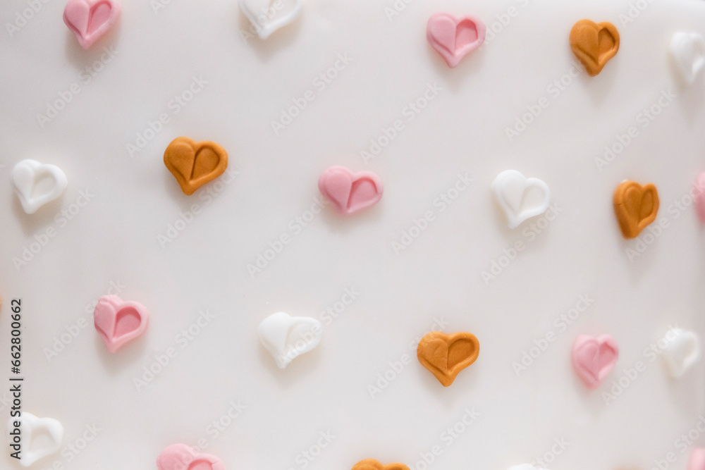 small colored sugar hearts on a white background
