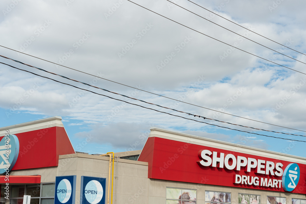 exterior building and sign of Shoppers Drug Mart, a pharmacy, located