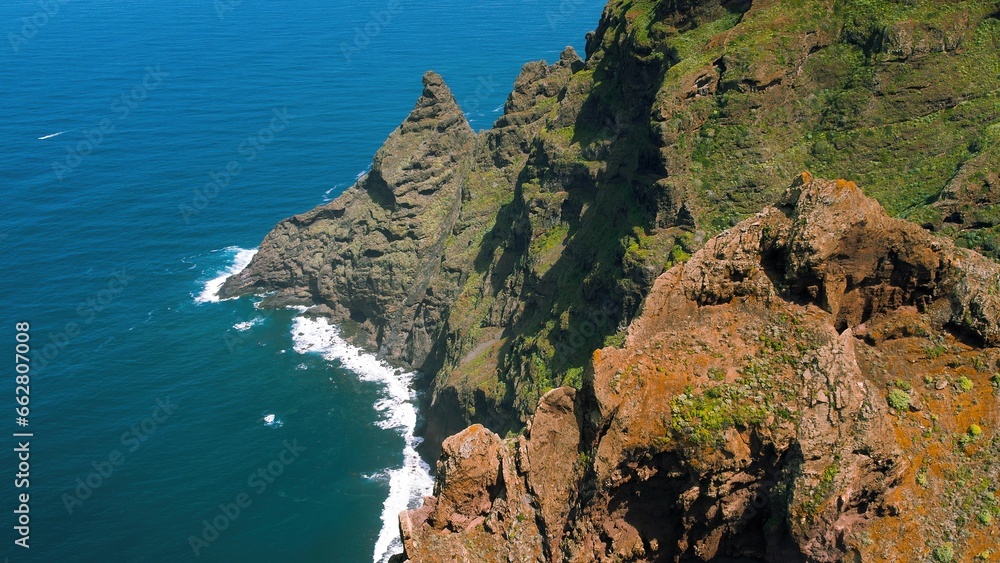 Fototapeta premium Green mountain landscape on ocean coastline, hiking trail in Anaga rural park. Chinamada Tenerife Canary Islands Spain.