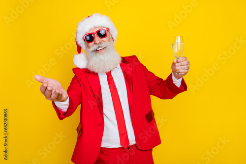 Photo of excited cheerful person hand hold champagne glass tell toast corporate event isolated on yellow color background