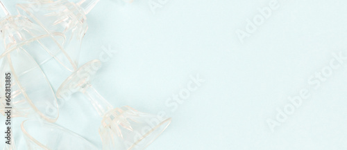 Banner with crystal glasses on a blue background. Place for text.
