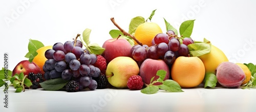 Assorted ripe juicy fruits plums peaches grapes lemons apples Ideal for vegetarian raw diets like salads smoothies or juices With copyspace for text