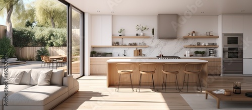 Contemporary kitchen and living area with a view of the yard With copyspace for text