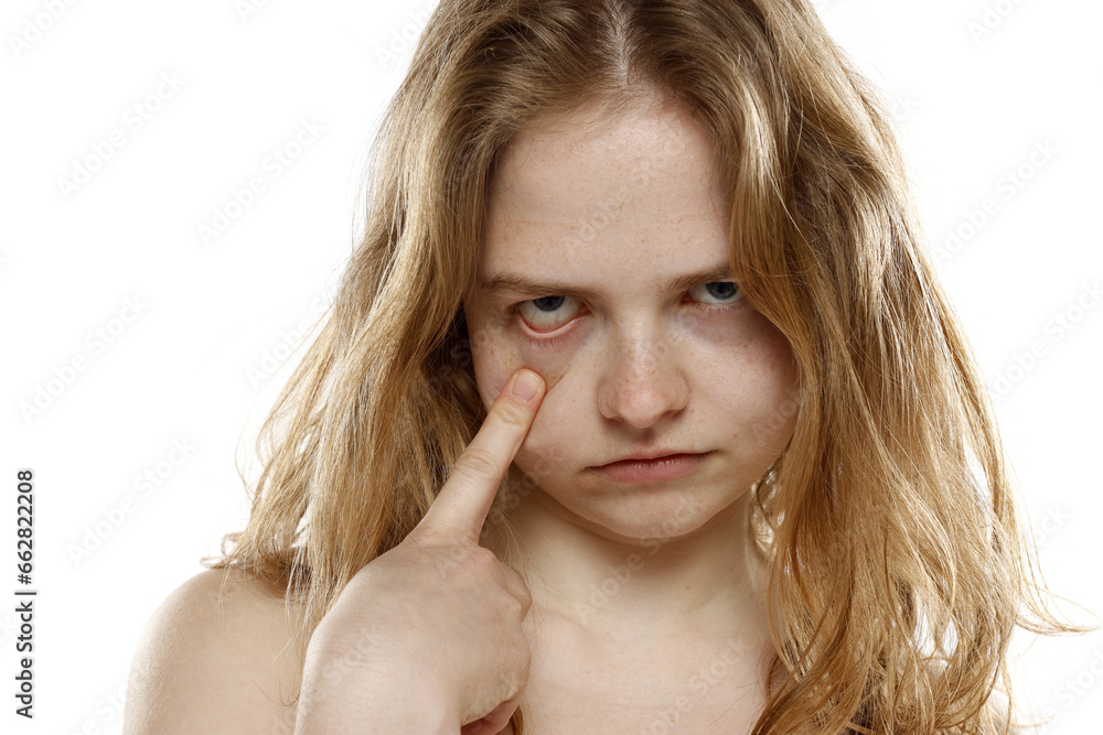 woman pulliing her lower eyelid with her finger on white background woman pulliing her lower eyelid with her finger on white background